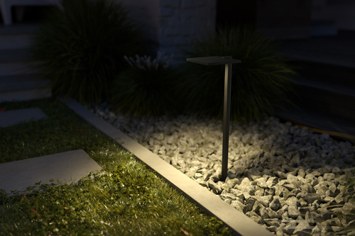 Grass with stepping stone pathway lite by a pathway light